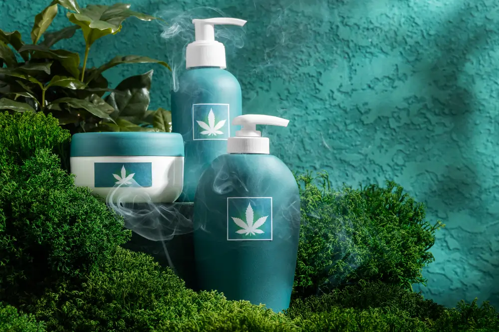 Cannabis skincare products on moss.