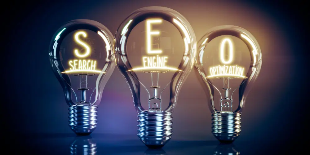 Three light bulbs spelling SEO